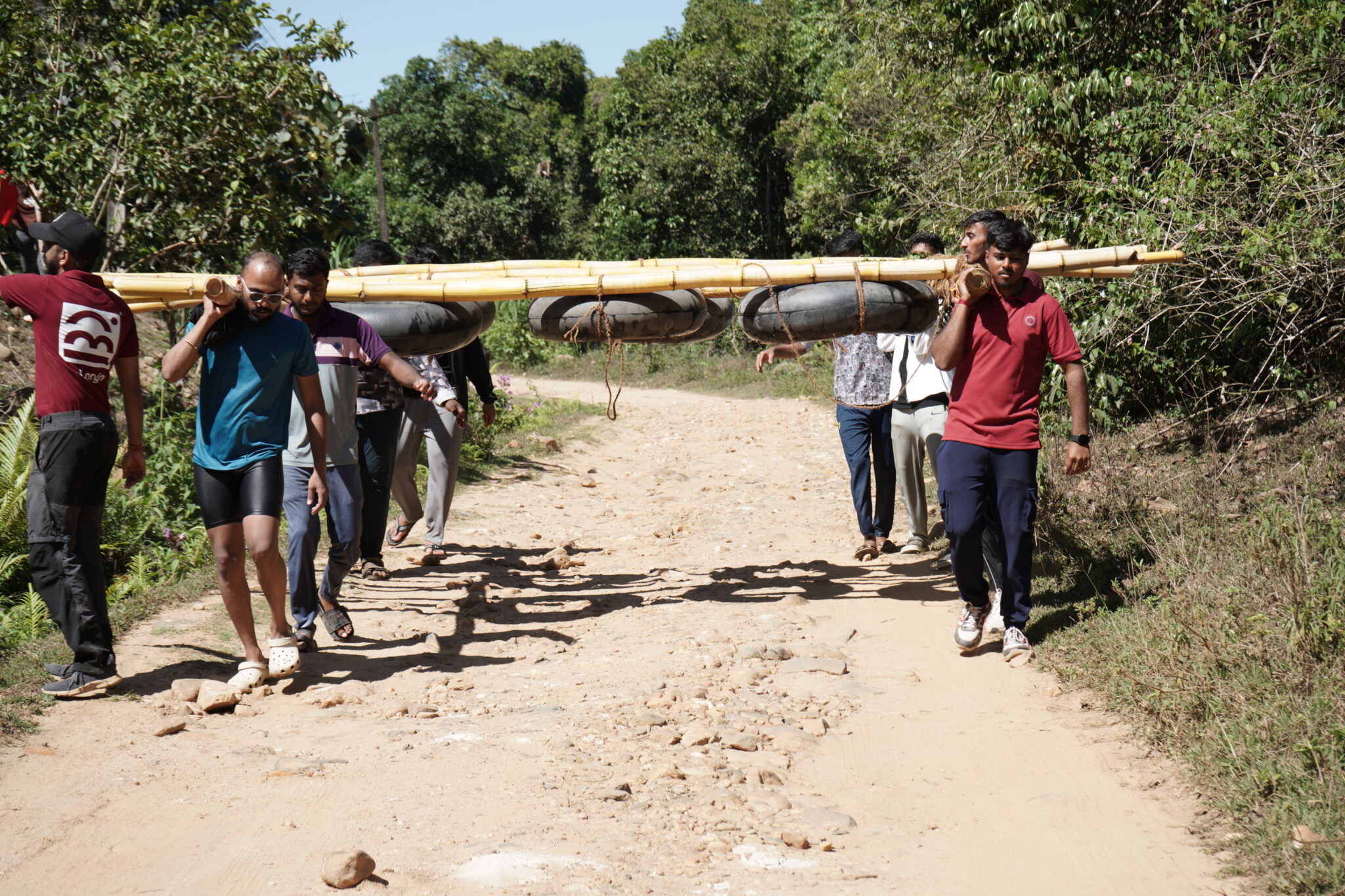 MBA students participating in a raft building team activity during an outbound experiential learning program